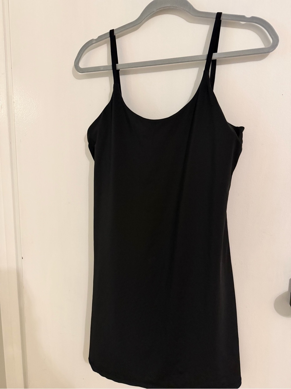 Black fitted athletic romper in size Medium.